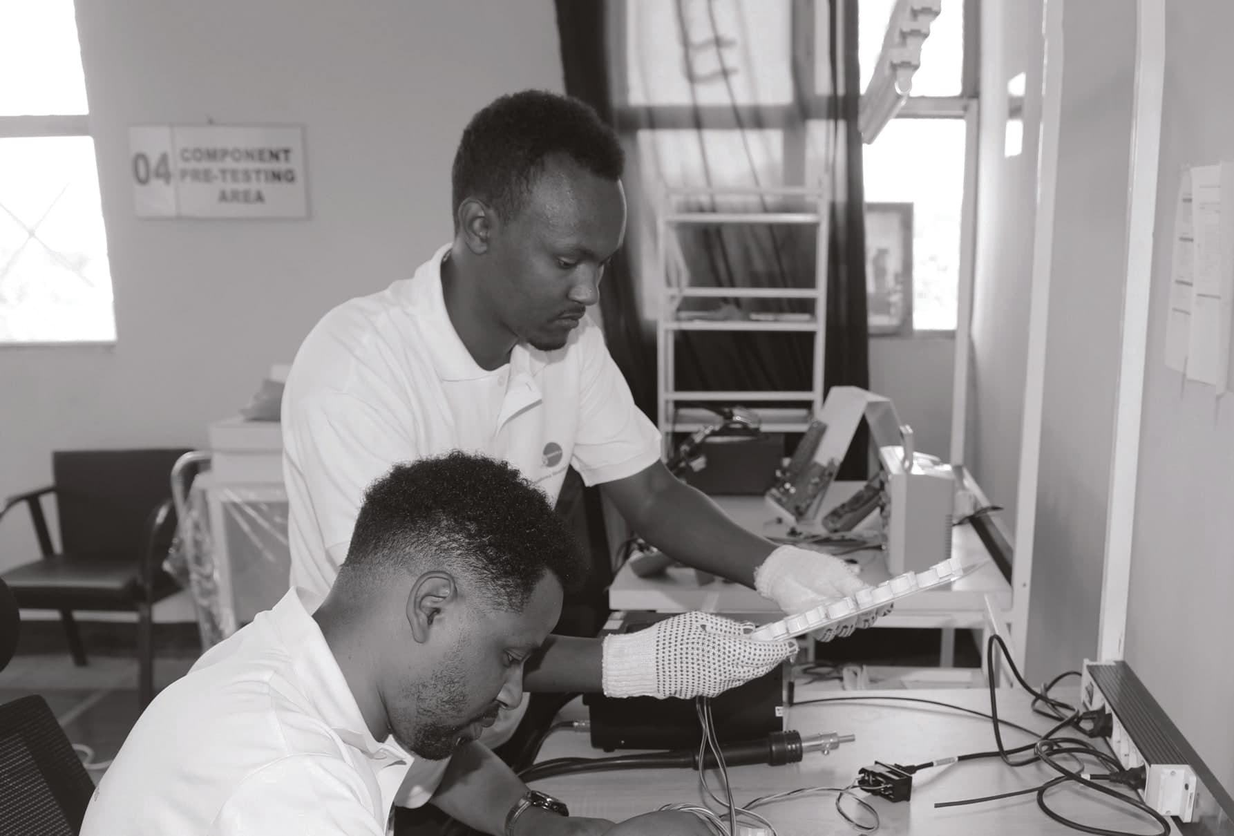 Simbona engineers assembling and testing electronics on the factory floor