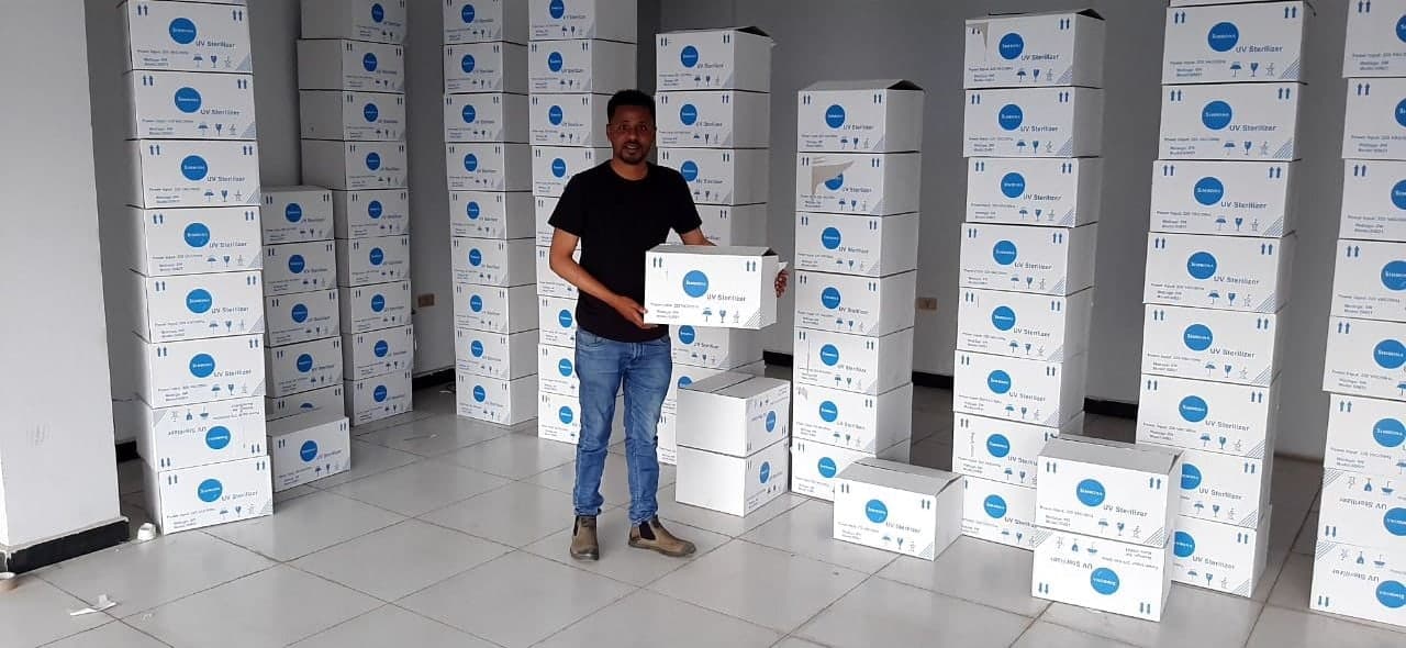 Cartons printed “Simbona UV Sterilizer” stacked for delivery
